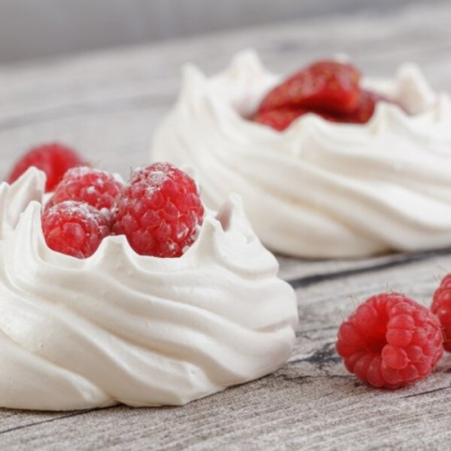 Raspberries and Chambord in Meringue Nests