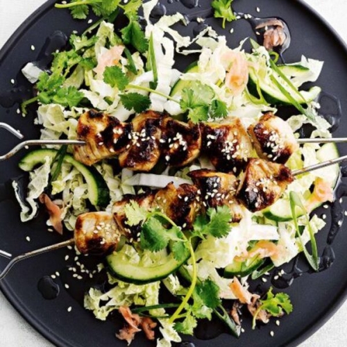 Sticky pork skewers with wombok slaw