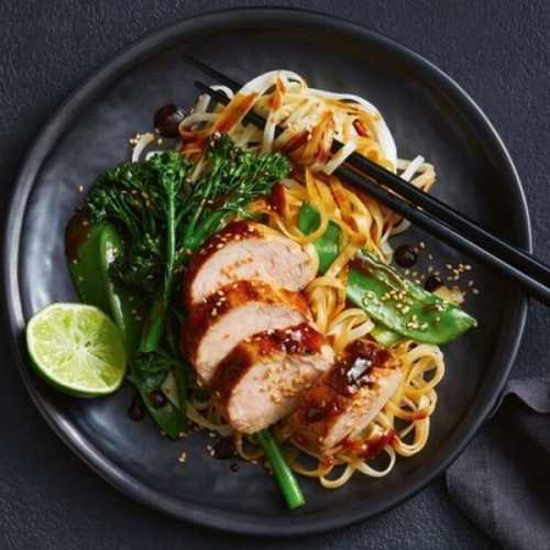 Healthy pork stir-fry with rice noodles and broccolini