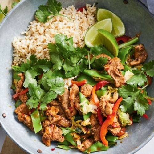 Ginger pork stir-fry with snow peas, cabbage and almonds