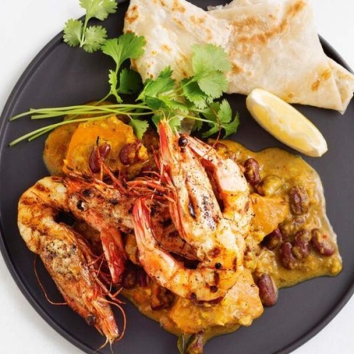 Pumpkin and kidney bean curry with barbecued prawns