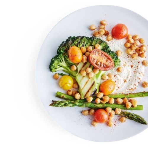 Broccoli steaks with roasted chickpeas, tomatoes and cashew dressing