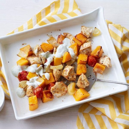 Chicken with butternut squash, cherry tomatoes and minty yoghurt dressing