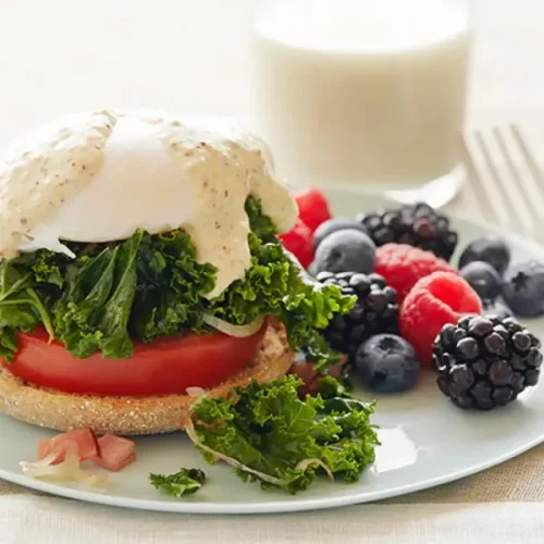 Kale and Tomato Eggs Benedict with Berries