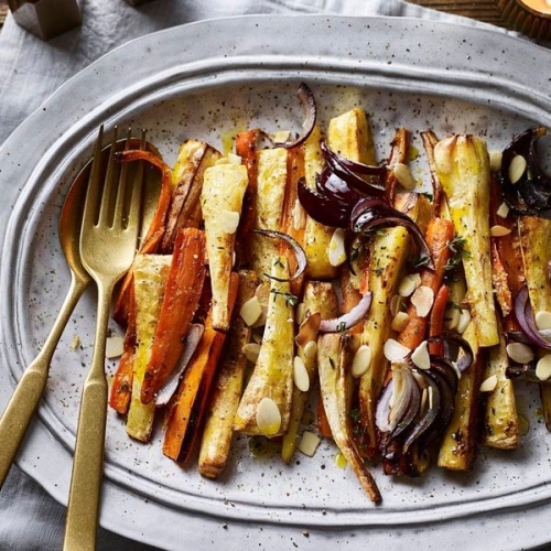Roast carrots and parsnips with orange and almonds