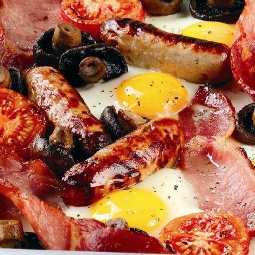 Baked breakfast with tomato and mushroom